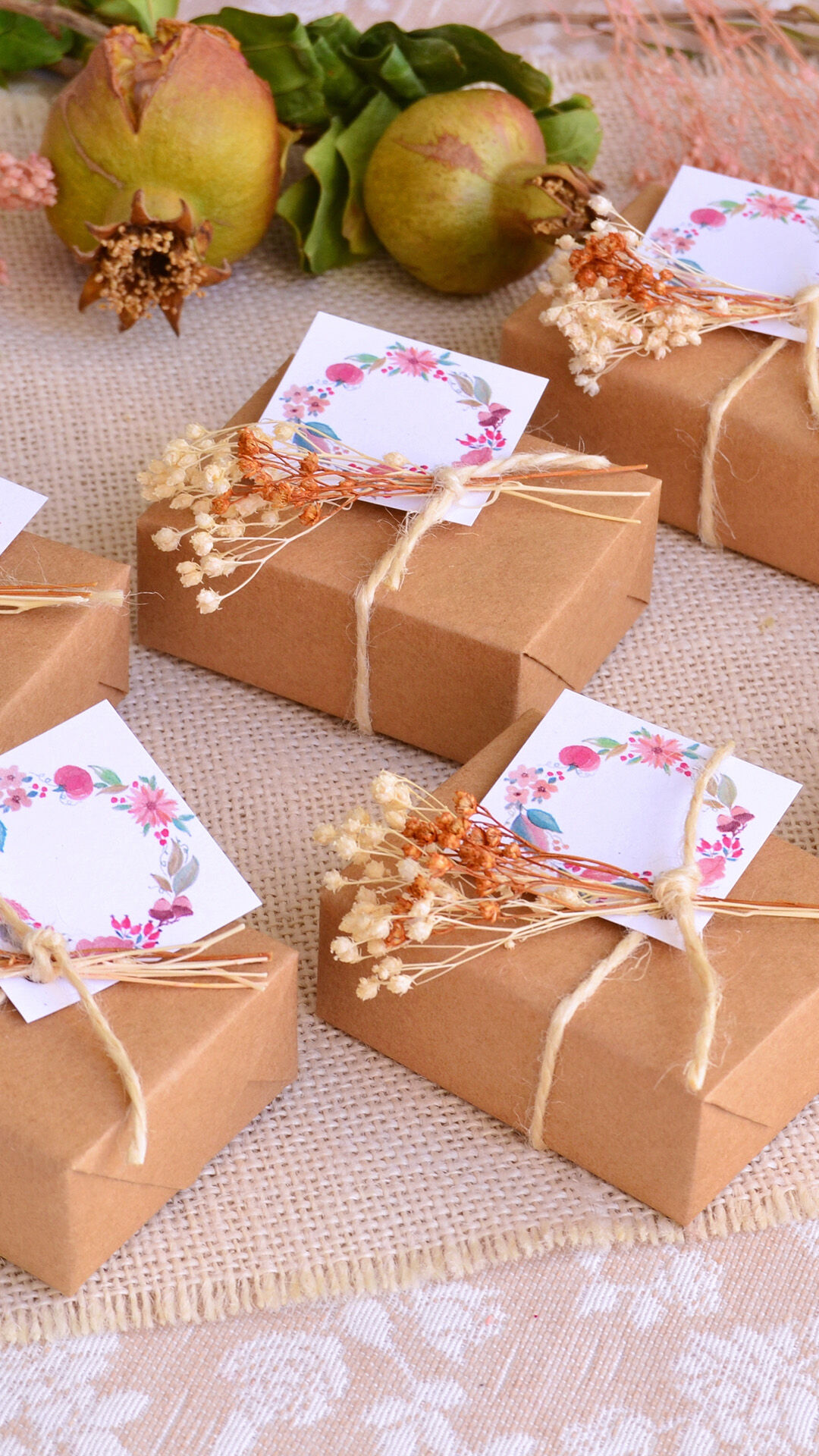 Charming wedding favor gift box with a personalized card and delicate flower embellishment.